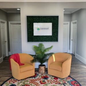 lobby area with chairs and Cereset brand logo sign