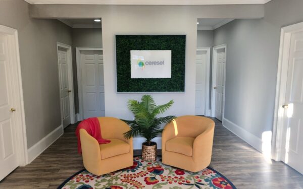 lobby area with chairs and Cereset brand logo sign