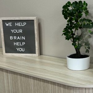 sign that says "We Help Your Brain Help You" in lobby of Cereset Fergus Falls