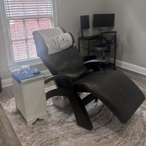session room with zero gravity chair and acoustic neuromodulation equipment for brain wellness