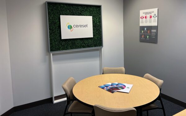 lobby area with table in front of Cereset logo sign