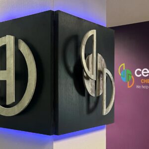 metal logo on wood next to Cereset Chesterfield wall sign