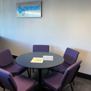 small conference room with metal Cereset backlit sign